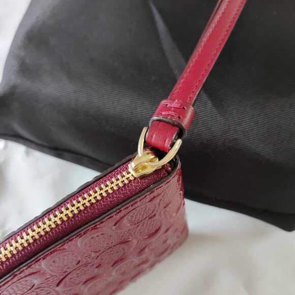 NWOT Coach Signature Debossed Leather Corner Zip Wristlet in BURGUNDY RED
